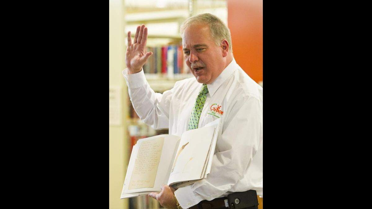Georgia Department of Education superintendent Richard Woods is pictured in 2016 while reading to children at the Washington Memorial Library in Macon start a summer reading program there.