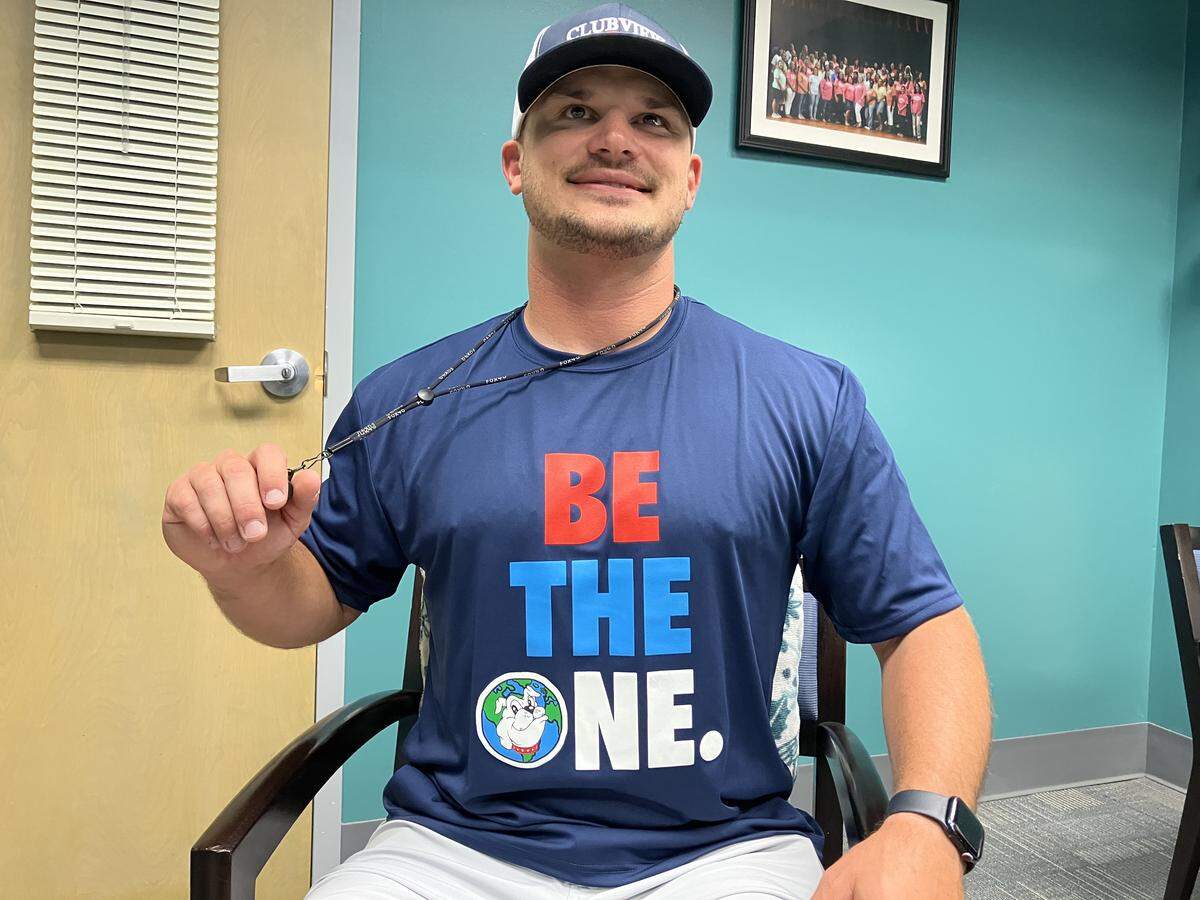 The day after the Muscogee Educational Excellence Foundation named him the Teacher of the Year in the Muscogee County School District, Clubview Elementary School physical education teacher Chris Grier, pictured May 8, 2026, wears a “BE THE ONE” T-shirt that sums up his teaching philosophy.