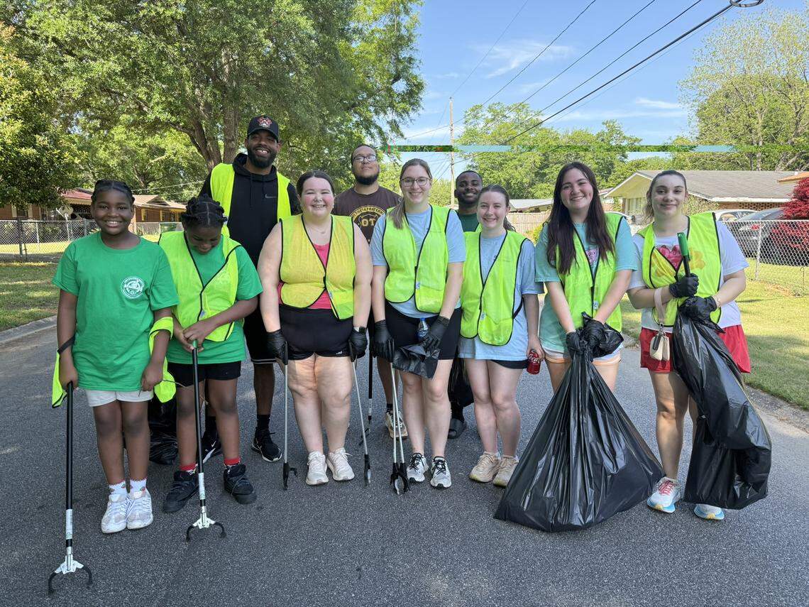 Some of the participants in the Keep Columbus Beautiful 2025 Earth Day events pose for a photo.