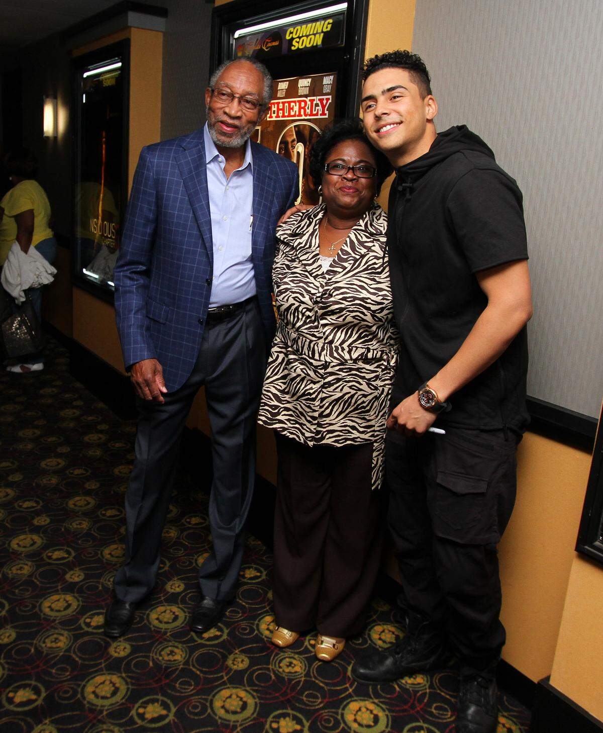 Joe Paull jpaull@ledger-enquirer.com   Quincy Brown, son of Kim Porter and Sean Combs, poses with Dr. Robert Wright and Gloria Perry at Carmike Hollywood Connection Ritz 13 Friday evening. Quincy Brown is in Columbus to promote the movie “Brothery Love” in which he is a co-star.