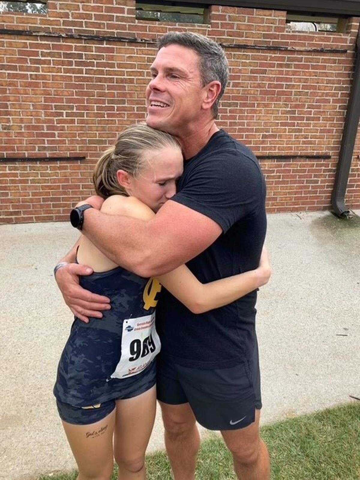 Donnie Ellis is the coach of Effie Ward and the other runners on the Harris County High School girls cross country team.