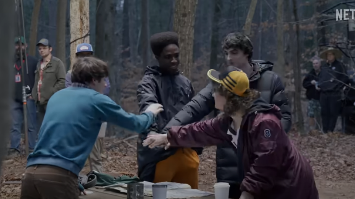 Cast members of Stranger Things Season 5 during a behind the scenes video.