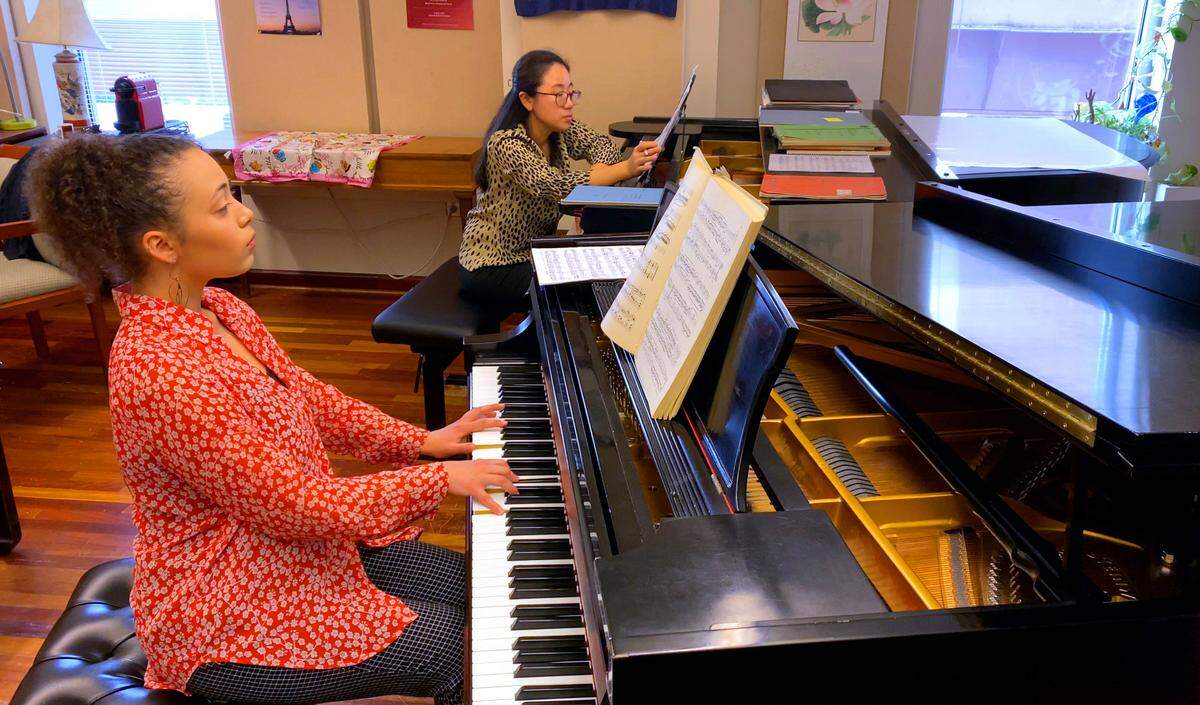 Nikol Bazalytska, left, a student at Columbus State University, plays as Esther Park, associate professor of piano at CSU’s Schwob School of Music, listens. 02/24/2023
