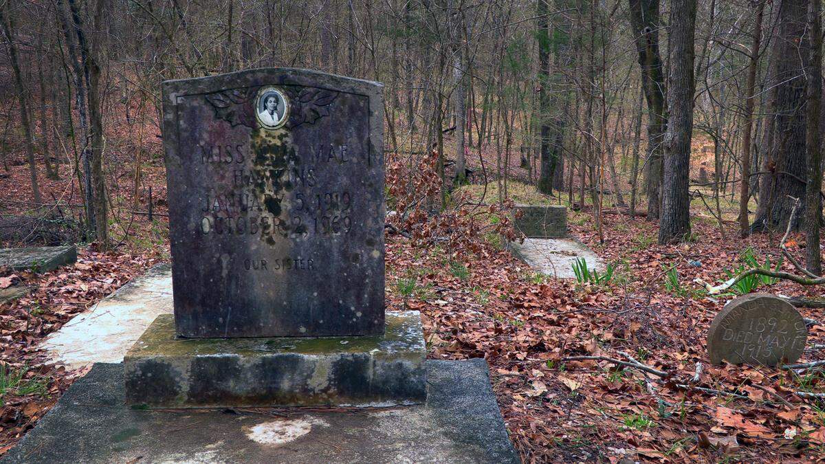 The grave of Alva Mae Hawkins at Shippey Cemetery in Columbus, Georgia includes a headstone inset with her photograph.