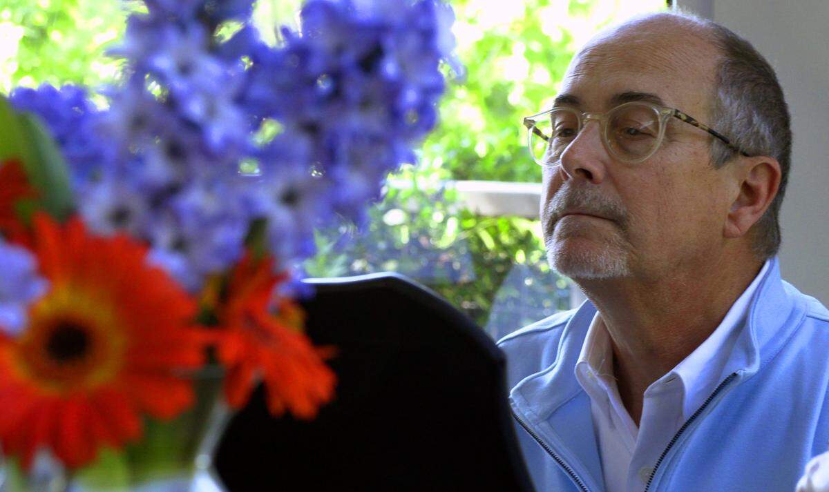 Along with his wife, Marquette, Rick McKnight, shown in April 2020, shared their passion for hymns during the coronavirus pandemic by posting online videos created by Marquette of Rick playing hymns on the piano in their Columbus home.