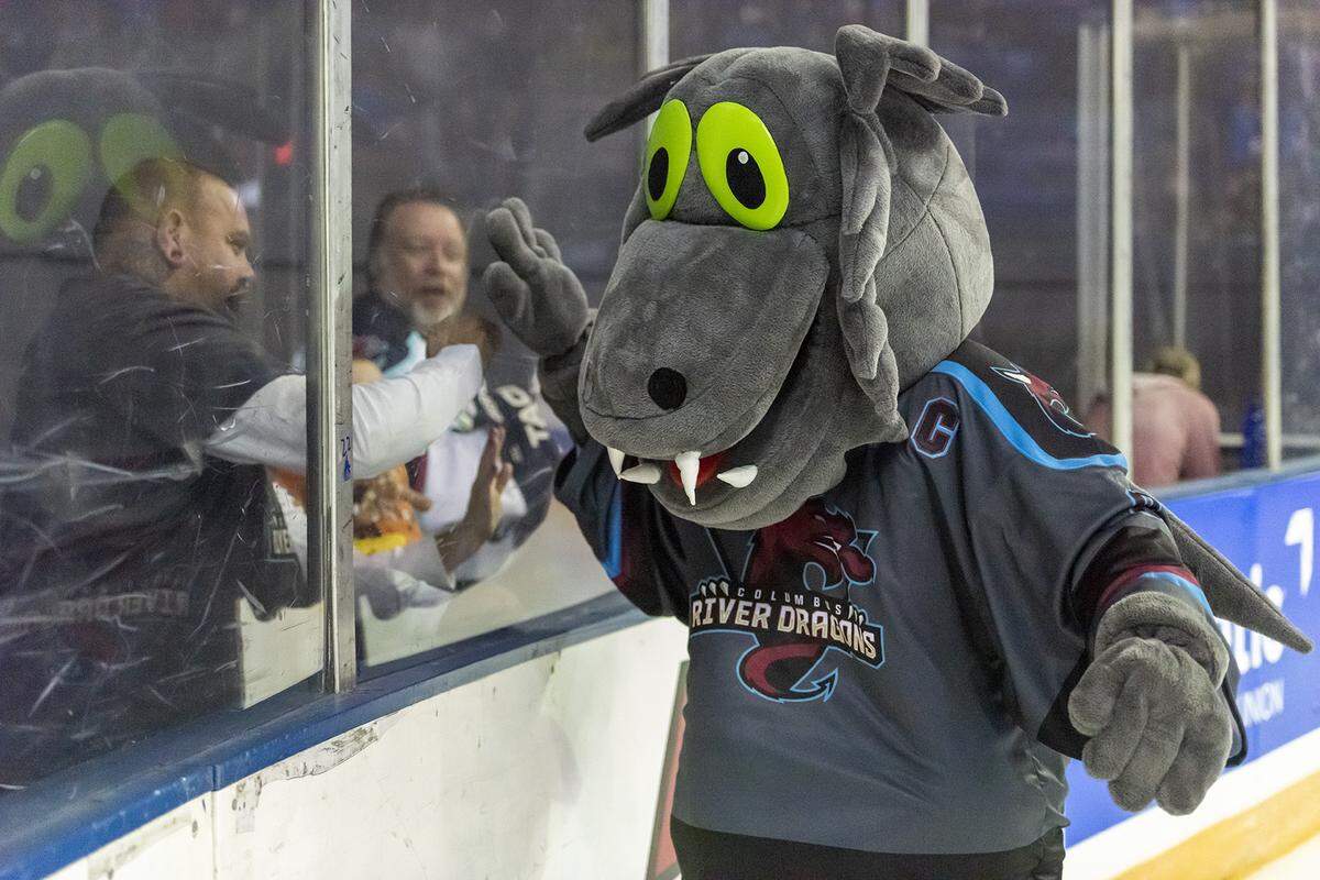 Torch, the Columbus River Dragons mascot, greets fans as he enters the area for the first home game of the River Dragons’ season Friday night against the Elmira Enforcers at the Columbus Civic Center. The Columbus River Dragons played their first home game of the season Friday night against the Elmira Enforcers at the Columbus Civic Center. The Enforcers won the game 4-3 in overtime on a goal by Brandon Tucker, his second goal of the night before a recorded attendance of 4,113. Zach Pease, Tim Santopaola, and M.J. Graham scored the River Dragons’ three goals. Elmira finished the game with 47 shots on goal, and the River Dragons took 32 shots. The two teams faced off again Saturday night at 6:05 p.m. at the Civic Center. Results were not available at press time.