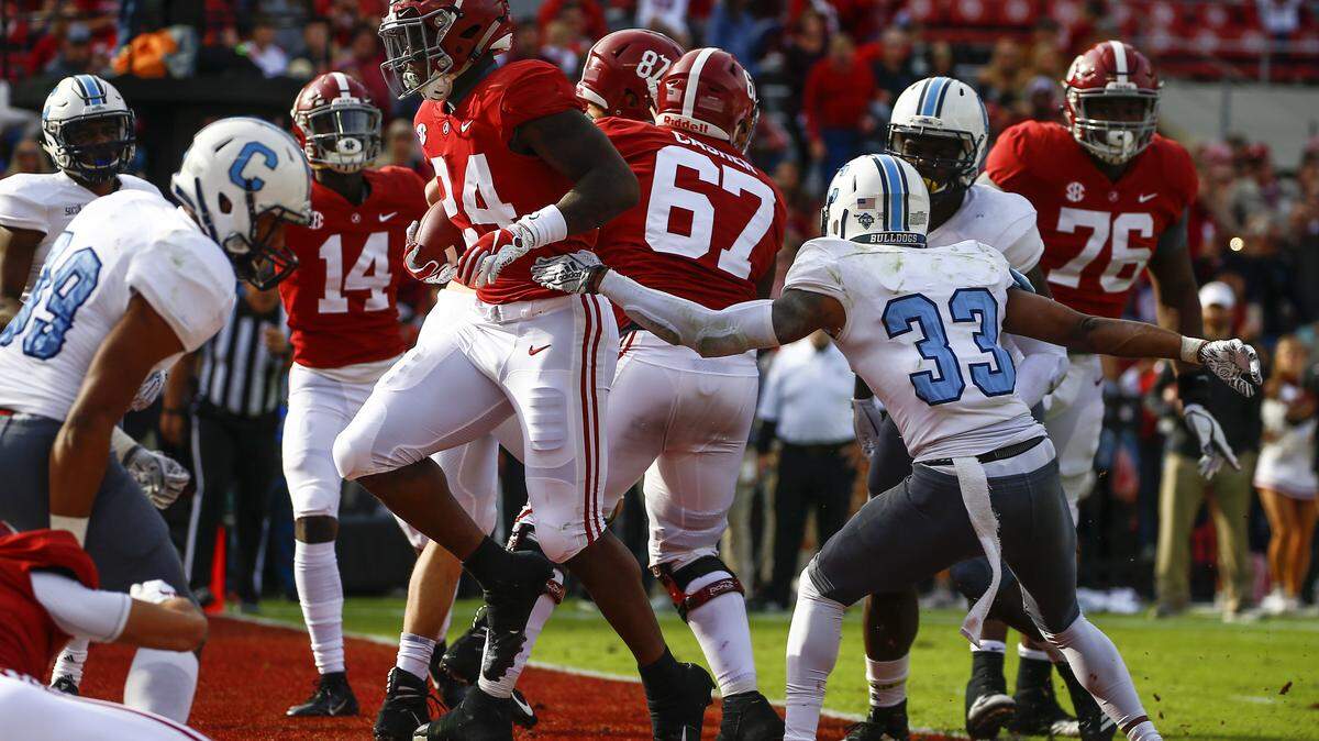 Alabama running back Brian Robinson Jr. (24) carries the ball in for a touchdown during the second half of his team’s game against Citadel on Saturday in Tuscaloosa, Ala.