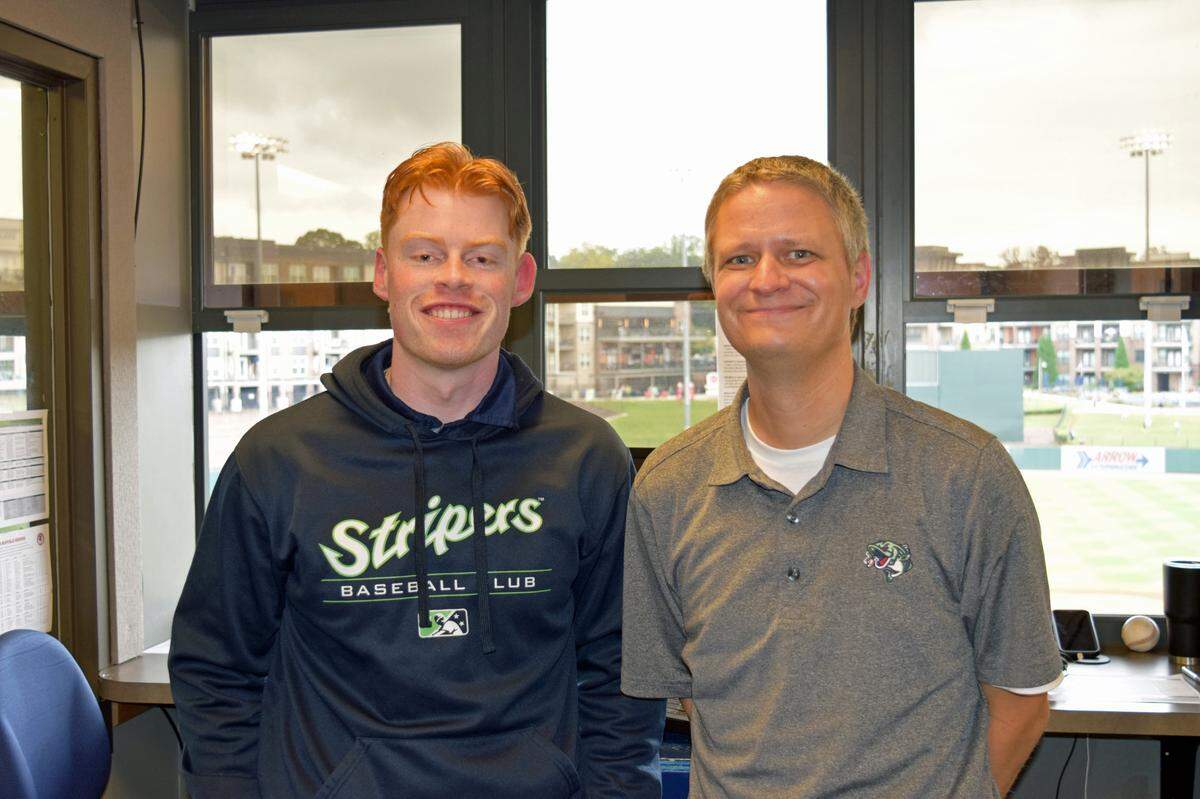 Jack Johnson, left, stands alongside Dave Lezotte, the lead broadcaster for the Gwinnett Stripers, the Atlanta Braves’ Class AAA affiliate, where Johnson was the No. 2 broadcaster. Johnson says Lezotte gave him his first shot announcing in pro baseball. The Columbus Clingstones recently announced Johnson has been hired as the first lead broadcaster and play-by-play voice of the Atlanta Braves’ new Double-A franchise.