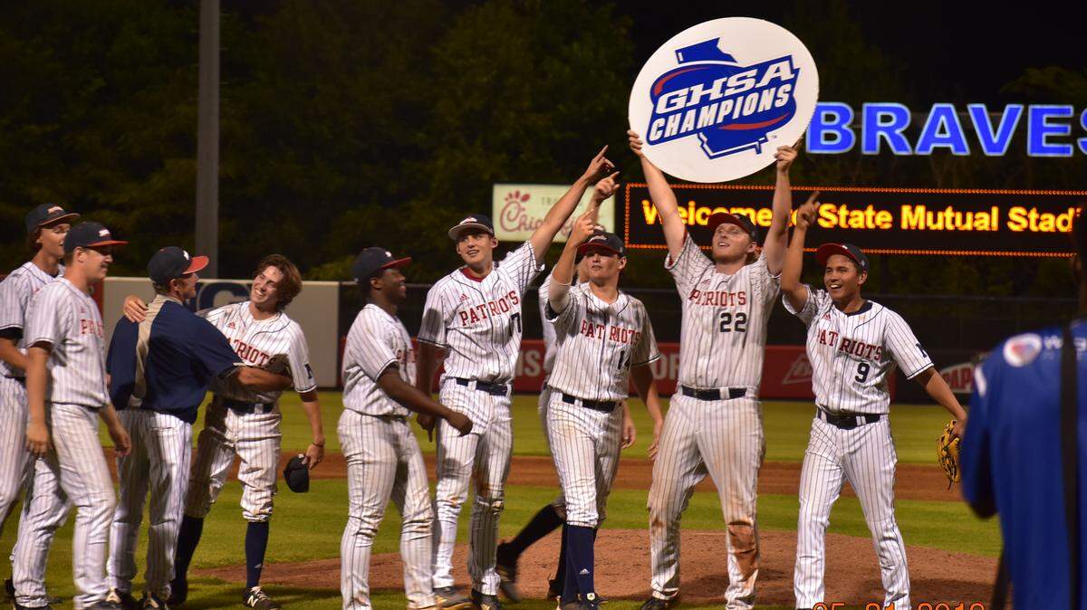 Northside players celebrate winning the Georgia High School Association Class AAAA baseball state championship series after sweeping Denmark 7-6 and 11-2 at State Mutual Stadium in Rome on Tuesday, May 21, 2019.