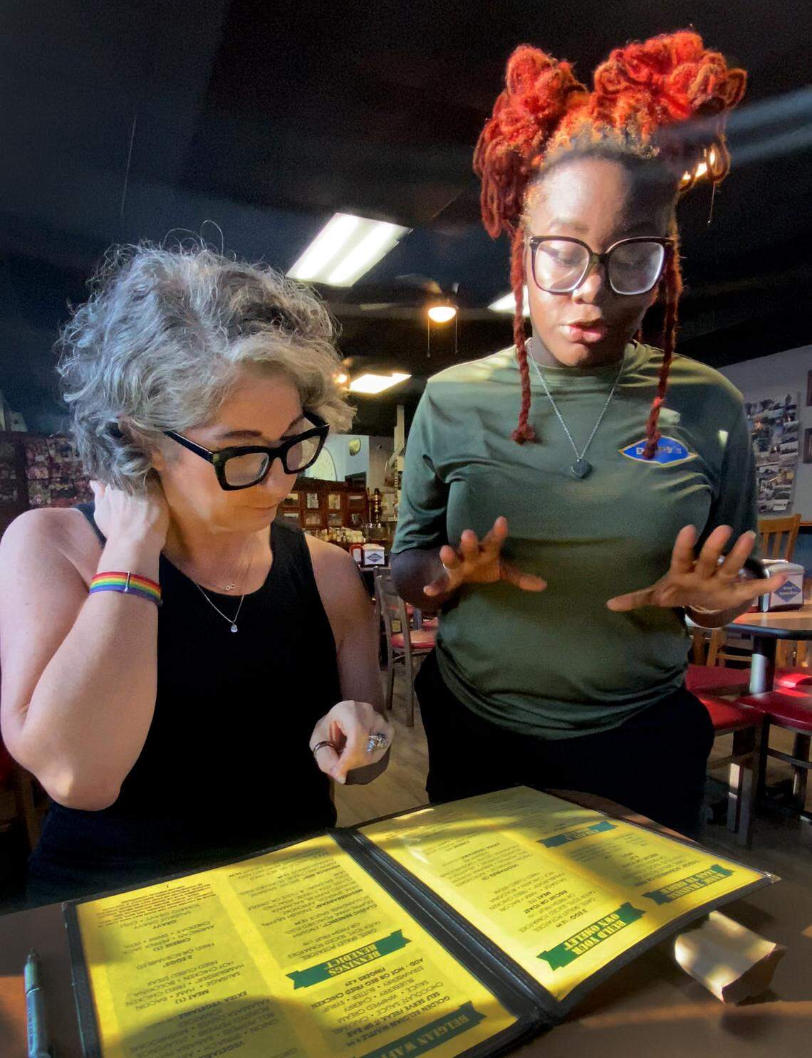 For this installment of "Columbus on a Budget" reporter Sundi Rose, seated, had breakfast at Darby's Patrol Base in Columbus, Georgia. She asked Jorden Braswell, a server at the restaurant, for advice on how to get the most for her budget. 08/15/2025