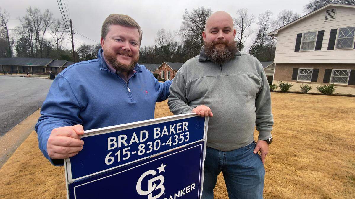 Realtor Brad Baker, left, is helping Aaron Hebert, right, sell the Heberts’ Columbus, Georgia house and purchase a different house. 02/02/2023