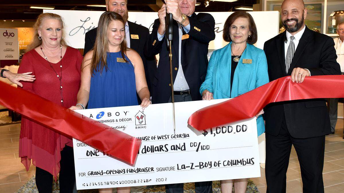 Renee Sturkie, executive director of the Ronald McDonald House of West Georgia,left, receives Wednesday evening a $1,000 donation from La-Z-Boy of Columbus representatives Susan Evans, Bryan Evans, Bill Evans, and Cindy Evans. Also pictured is Columbus City Councilor Bruce Huff,right.