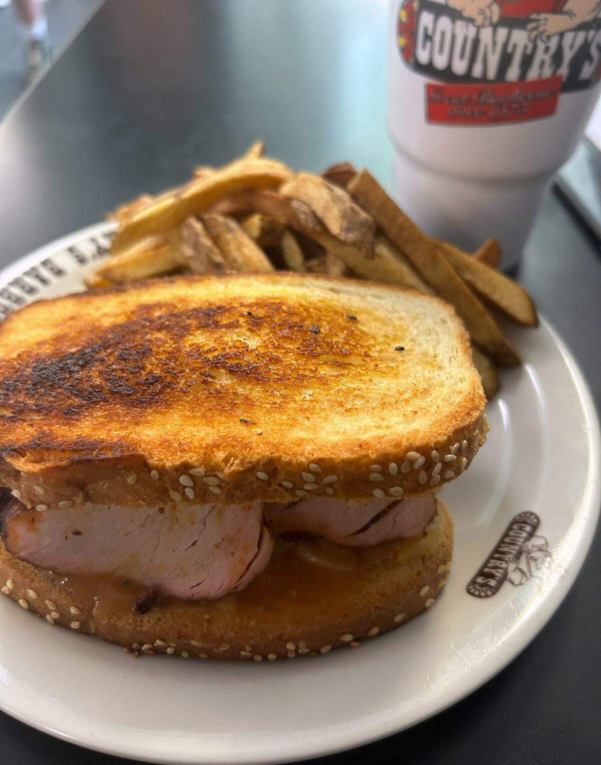 This is the pork tenderloin sandwich with fries at Country’s Barbecue in Columbus, Georgia. 07/12/2024