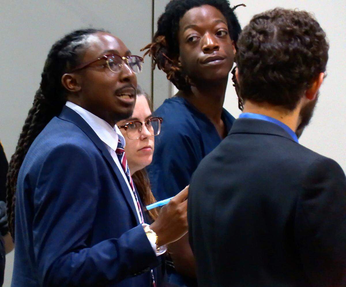 Dequarius Devonte Richardson,17, facing camera, right, appears for a preliminary hearing in Columbus Recorder’s Court Friday morning, Jan. 3, 2020. Richardson was represented by defense attorney Ralston Jarrett, left, at the hearing. Richardson,17, has been charged with murder in the death of Javante Jackson, 26, who was found shot to death at Elizabeth Canty Homes off Cusseta Road. Police have also charged a 16-year-old male in this case. The juvenile appeared with Richardson at the preliminary hearing.