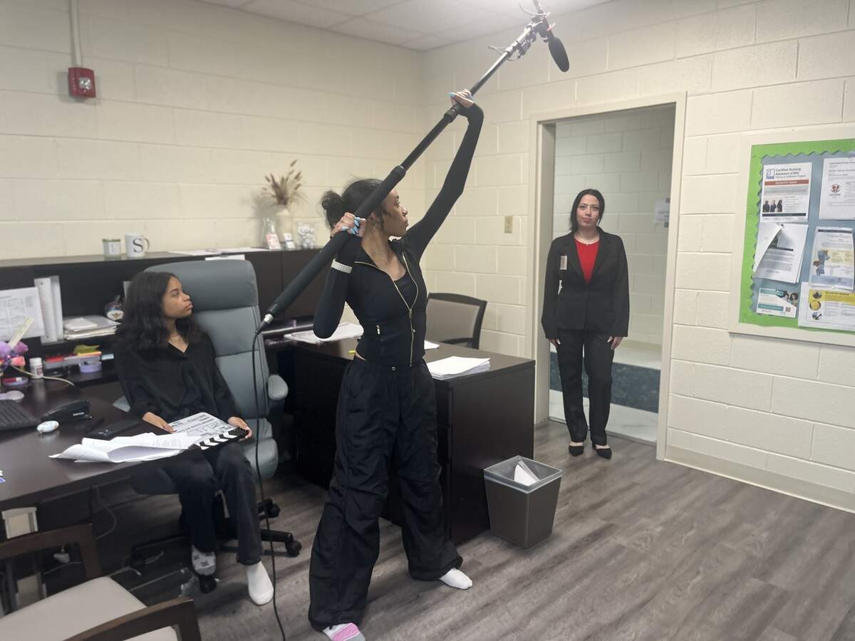 Alex Floyd, Charlie Floyd are pictured with Jessica Davis, a lead actor of HR Things playing Madison Weaver, filming a scene in HR Things, created by Columbus native GG Rodgers in 2026.