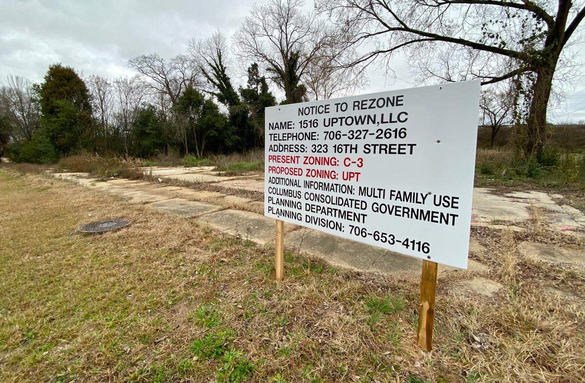 A rezoning sign at 1600 Third Ave. Columbus attorney and developer Ken Henson is building a 24-unit apartment complex a few blocks from the Columbus riverfront.