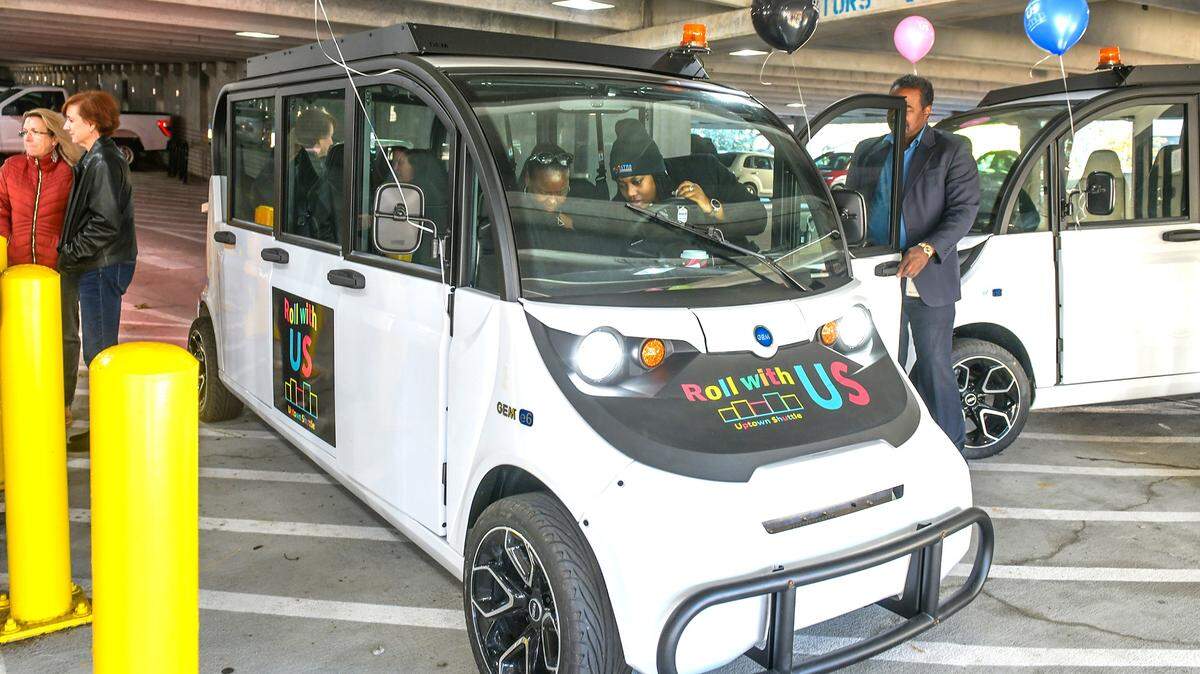 Columbus Consolidated Government Metra Parking Division staff show two of the four Uptown Shuttles during a news conference Dec. 15, 2023, at the RiverCenter garage.