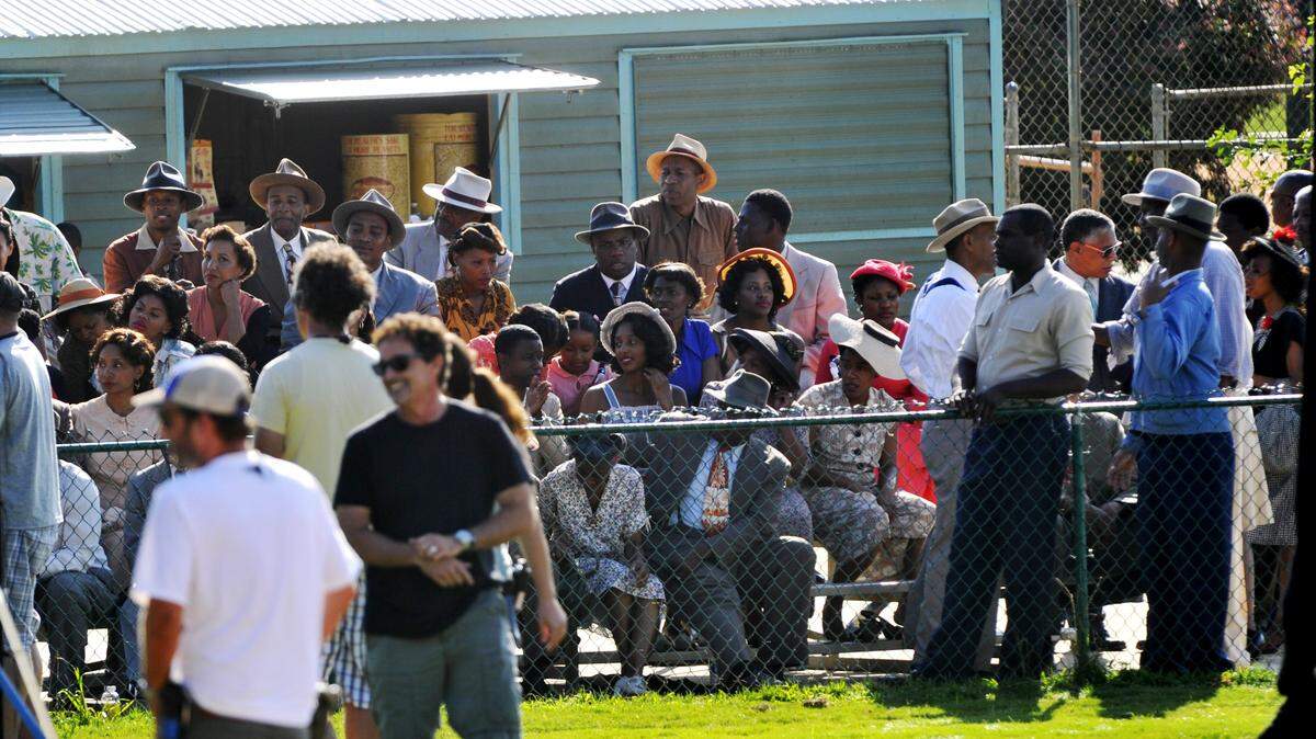 Extras dressed in 1940s style fill the stands around a stands Luther Williams Field in Macon on June 20, 2012 during the filming of “42”, a Jackie Robinson biopic.