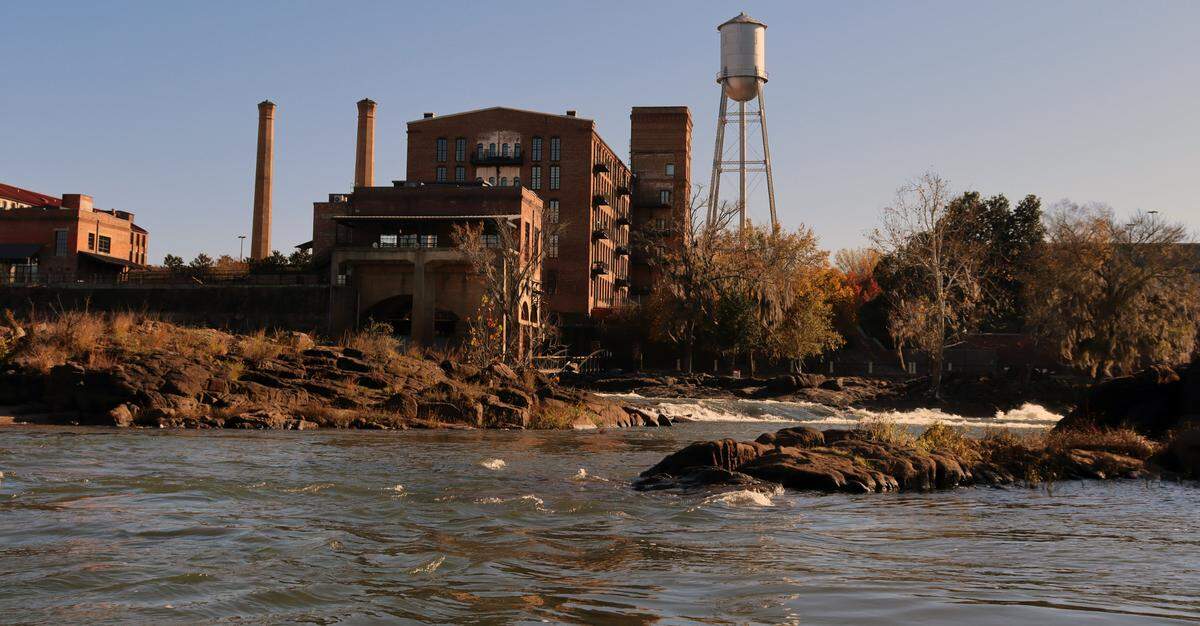The old Eagle and Phenix mill, now apartments, from the Chattahoochee River where the dam used to be.