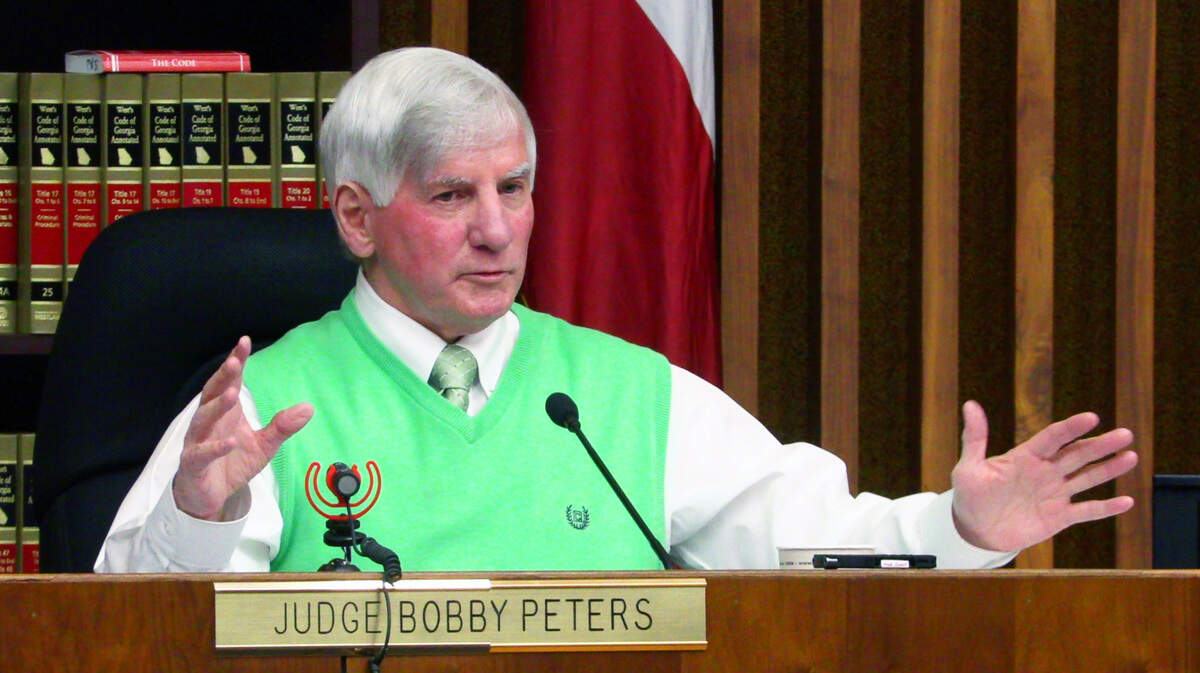Superior Court Judge Bobby Peters addresses attorneys Friday afternoon during a hearing for two sisters charged with murder. The sisters pleaded guilty Tuesday.