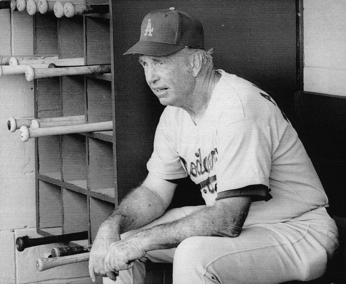 Walter Alston, veteran manager of the Los Angeles Dogers, directs his team from bean of all major league managers, Alston’s team won the National League pennant in 1974 only to be defeated by Oakland in the World Series.