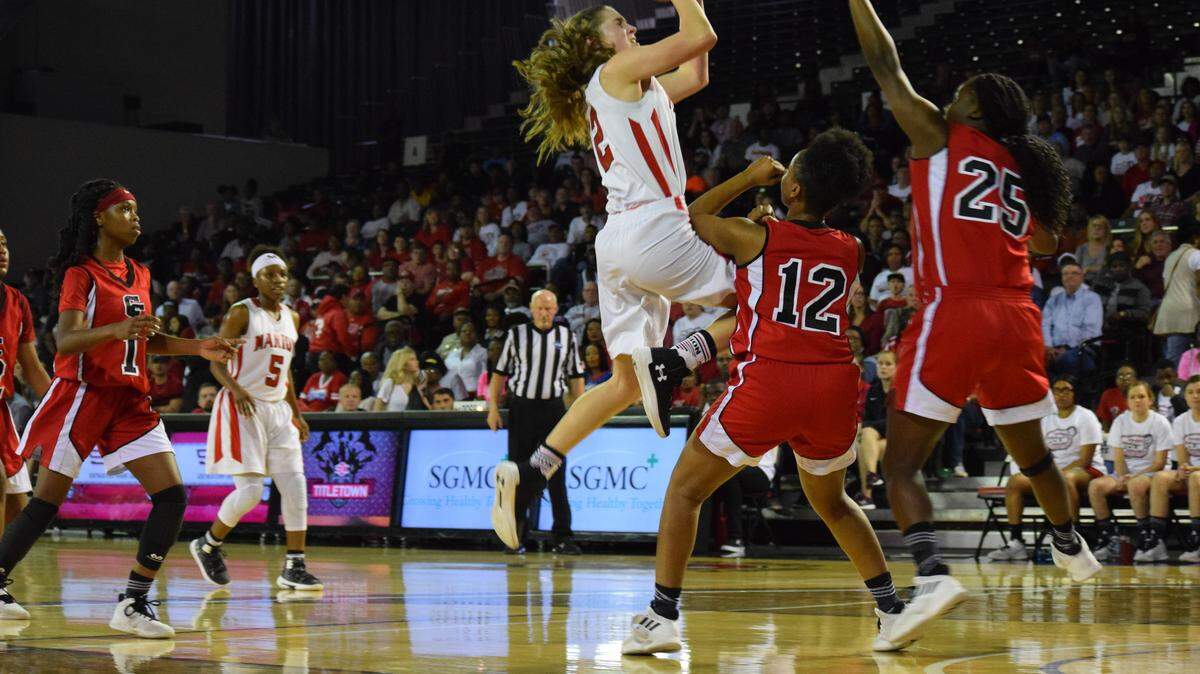Marion County senior forward Ashley Whitley drives to the basket Saturday against Clinch County in the Georgia High School Association Class A public school girls basketball state semifinals at Valdosta State University.