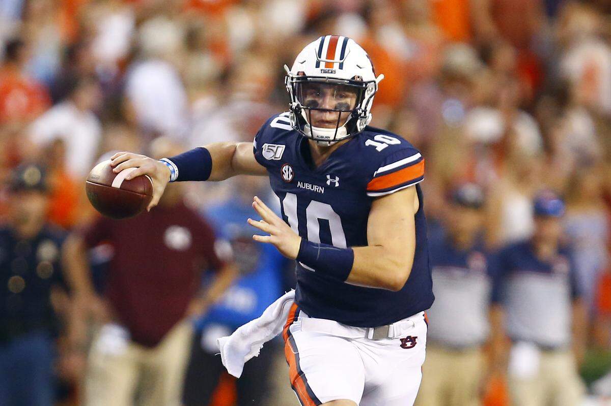 Auburn quarterback Bo Nix (10) rolls out to pass during the first half of an NCAA college football game against Mississippi State, Saturday, Sept. 28, 2019, in Auburn, Ala. (AP Photo/Butch Dill)
