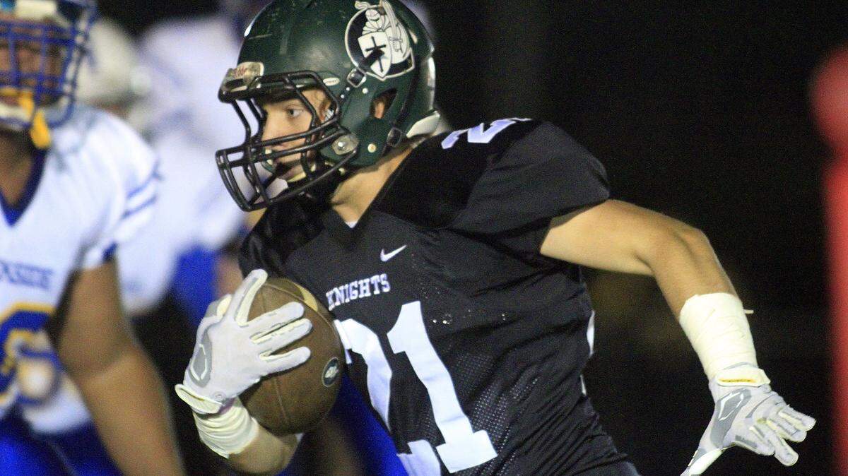 Photos by Mike Haskey/mhaskey@ledger-enquirer.comCalvary Christian's Ethan Cook gains yardage near the endzone in the first half Saturday night during their semifinal game against Creekside.