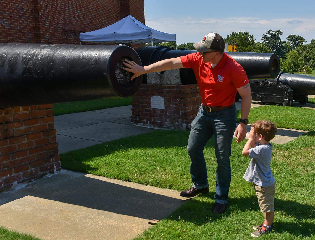 Daryl Rosenbauer and his son Bastian explore the cannons at the National Civil War Naval Museum during the 2020 RiverBlast Festival on July 4.