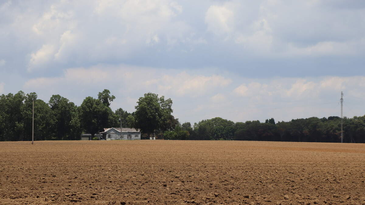 Dry soil stretches far on tilled farm in Americus, Georgia, in this June file photo. Farms and small businesses in Georgia are getting grant money to implement climate-friendly energy technology.