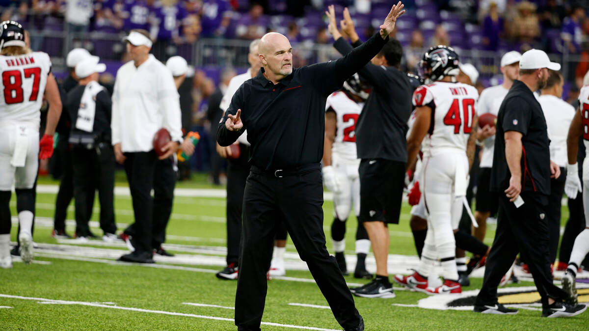 Atlanta Falcons head coach Dan Quinn waves to fans before an NFL football game against the Minnesota Vikings, Sunday, Sept. 8, 2019, in Minneapolis.