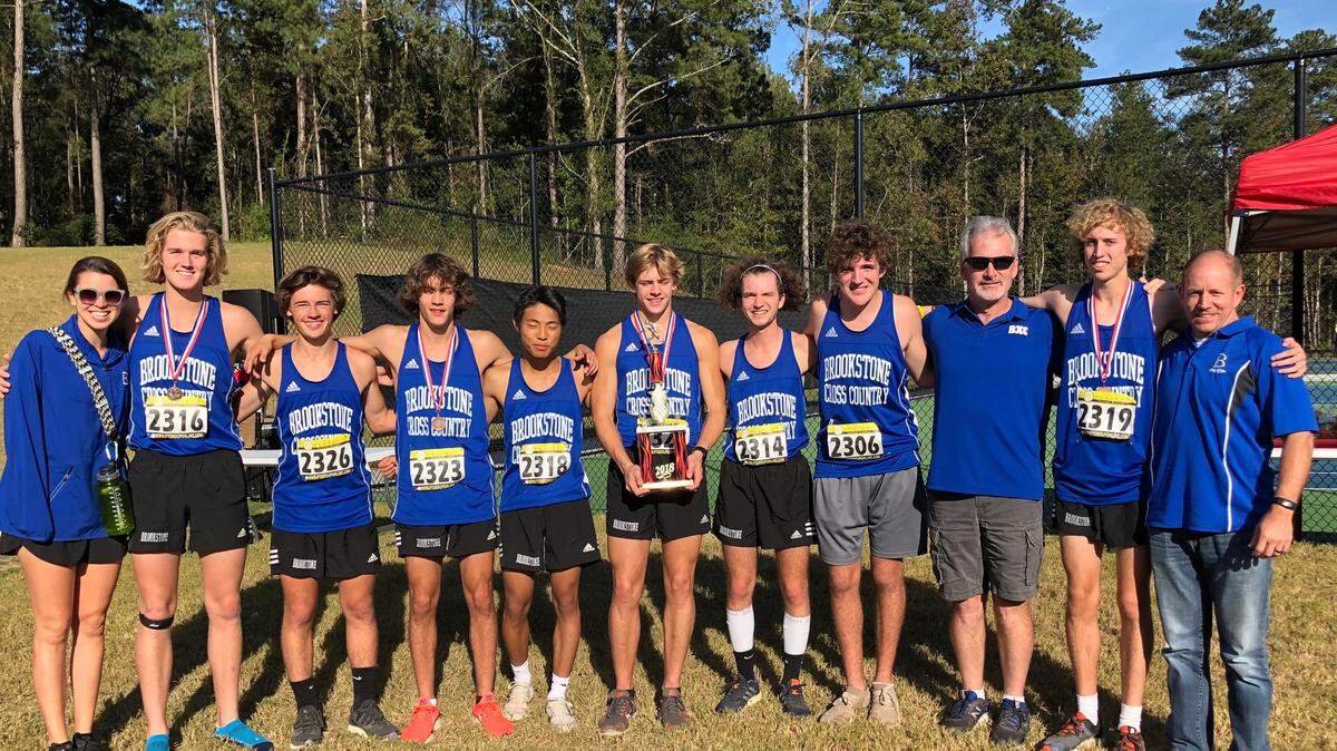 The Brookstone School boys cross country team won the Georgia Class A private school Area 1 championship Wednesday at First Presbyterian Day School in Macon. Pictured from left are: assistant coach Alex Chapman, senior Briggs Kalish, senior Noah Stenslie, senior Sid Saber, senior David Liao, senior Caleb Pattillo, senior Ryan Drew, freshman Mason Agnew, head coach Mark Erb, junior Joseph Loudermilk and assistant coach Todd Pate.