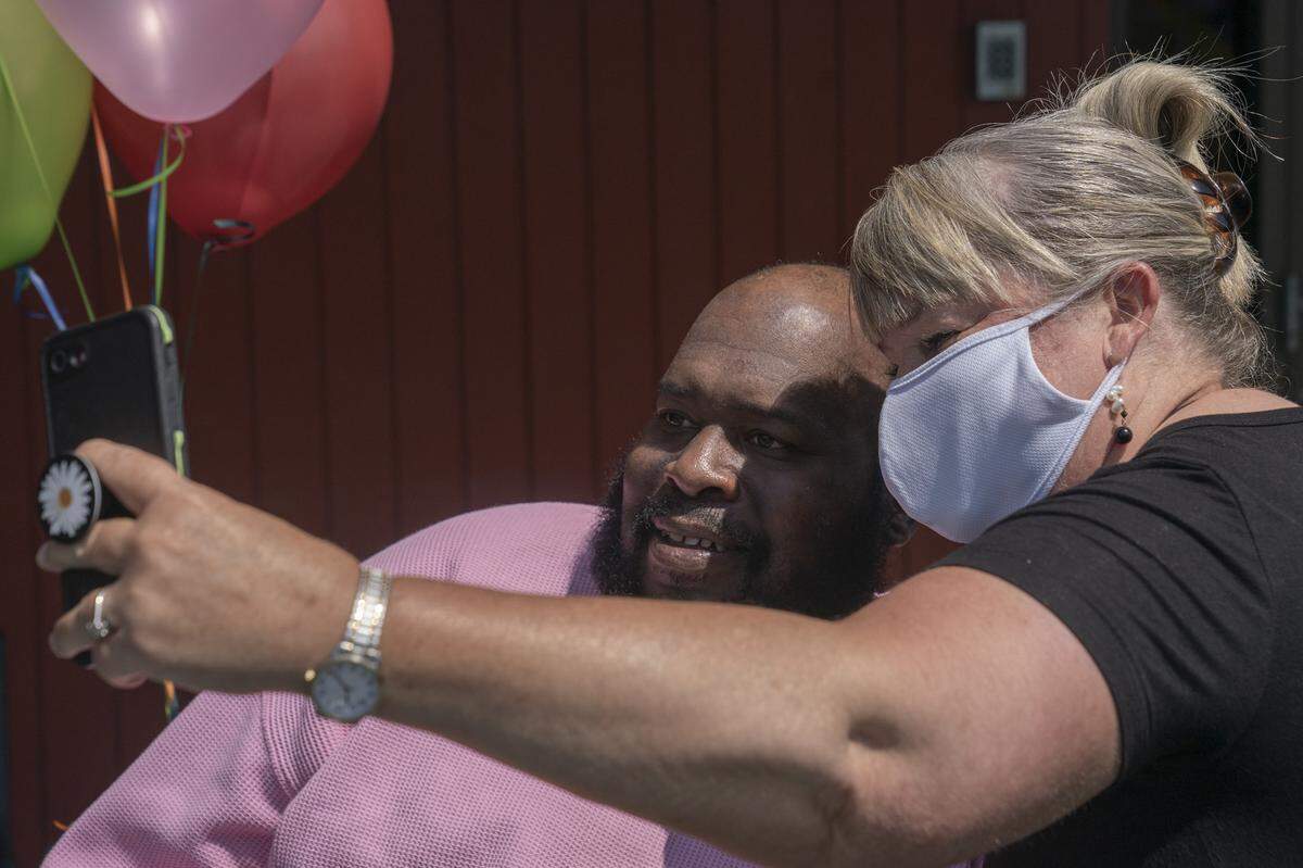 Eric Lofton and Julia Taylor take a selfie together on May 27, 2021, at River Towne Center nursing facility in Columbus, Ga.