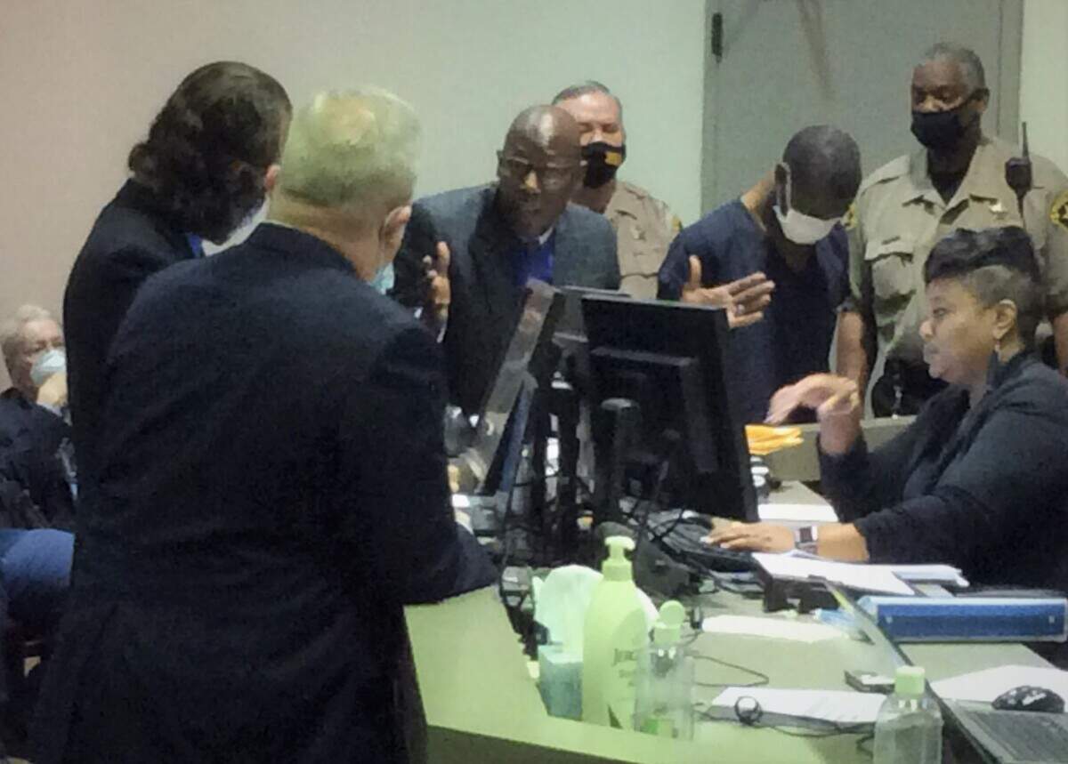 As his client David Harrison looks down, attorney Stacey Jackson questions Detective Robert Nicholas about the shooting that killed 12-year-old Cortez Richardson.