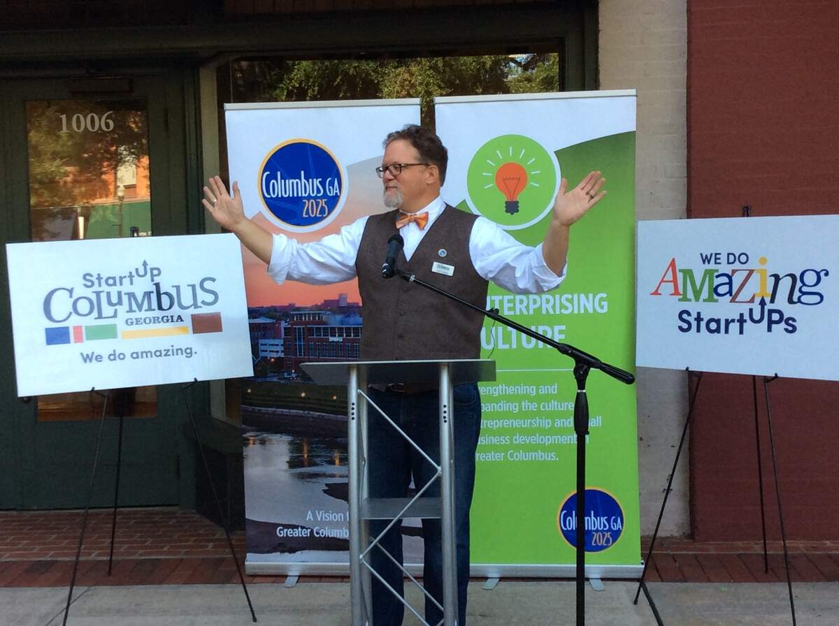 Frank Braski, chief entrepreneurial officer of StartUP Columbus, makes his pitch Friday outside the business incubator's new office space at 1006 Broadway.