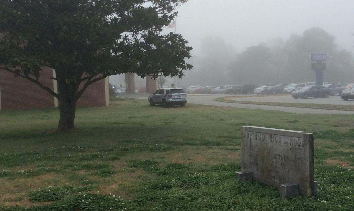 A police vehicle is stationed outside Northside High School in Warner Robins Friday morning.