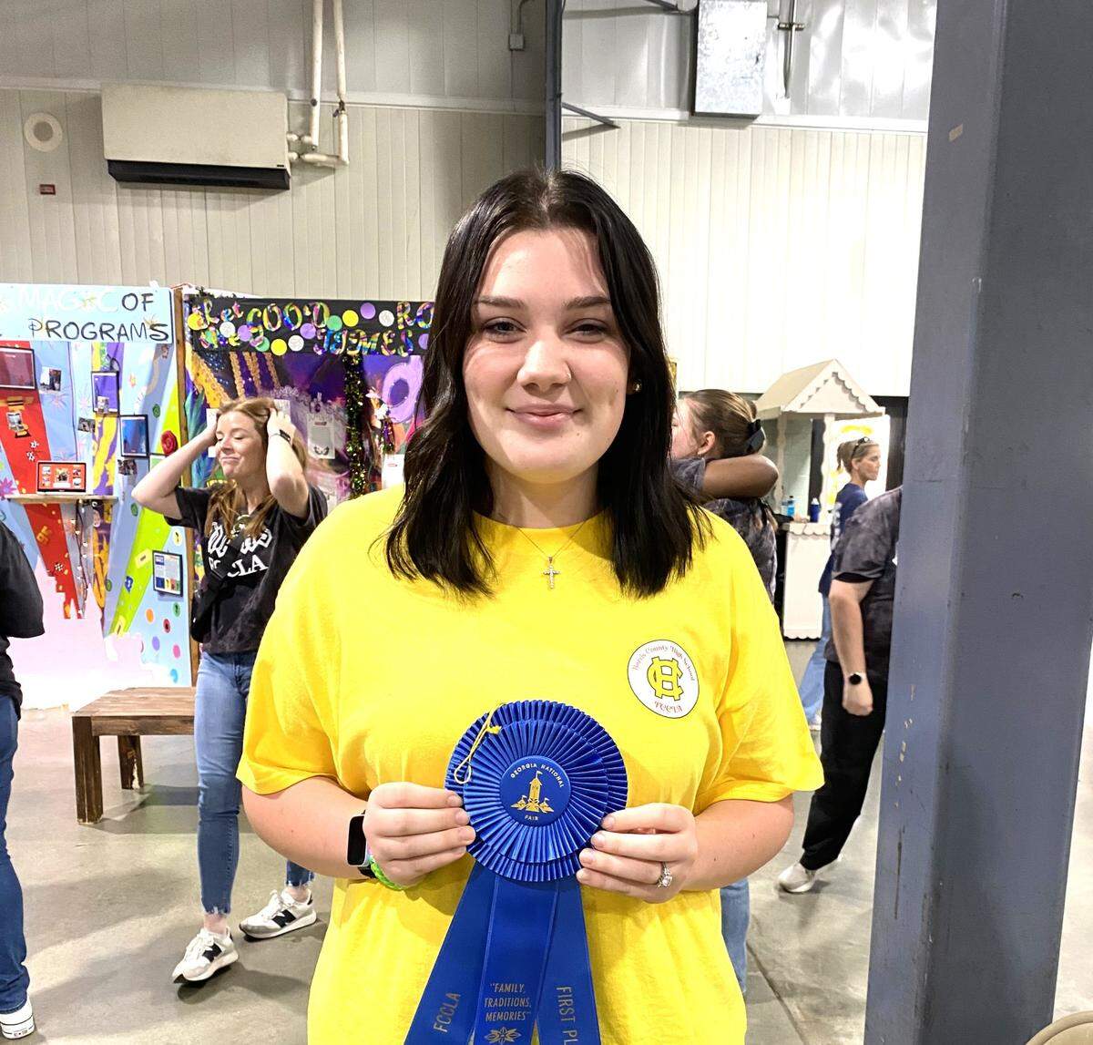 Harris County High School junior Addison Stewart shows the ribbon she won for finishing in first place during the Georgia FCCLA (Family, Career and Community Leaders of America) Themed Speech Competition at the 2024 Georgia National Fair in Perry.