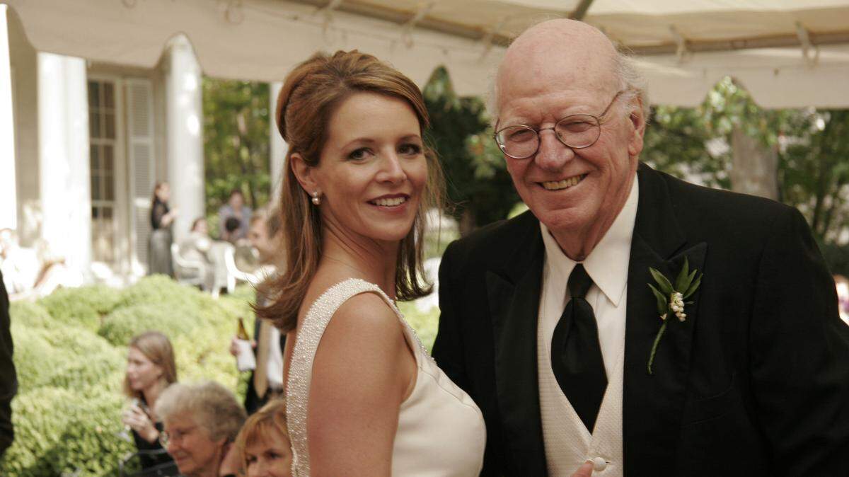 In this Sept. 30, 2006, photo provided by Mark C. Jenkins, is Ray Jenkins, right, and his daughter, Nancy Chafin, at her wedding in Richmond, Va. Ray Jenkins, a Pulitzer Prize-winning journalist who worked as a special assistant for press affairs in President Jimmy Carter’s administration, has died at age 89. Jenkins’ son Mark Jenkins says his father died Thursday, Oct. 24, 2019, at his home in Baltimore from congestive heart failure.