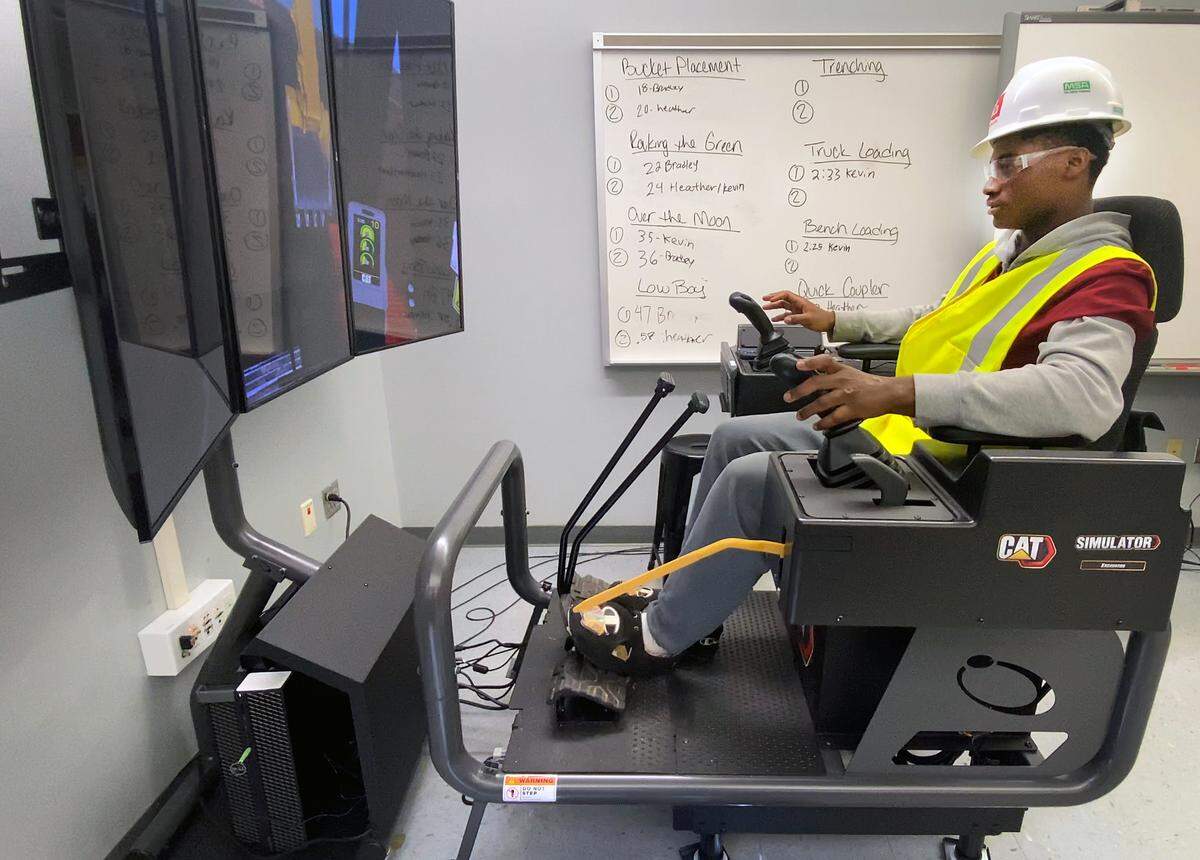 Greg Owens, 17, a senior at Jordan Vocational High School, works on a CAT Simulator as part of the school’s Heavy Equipment Operator Training Program. 09/23/2022