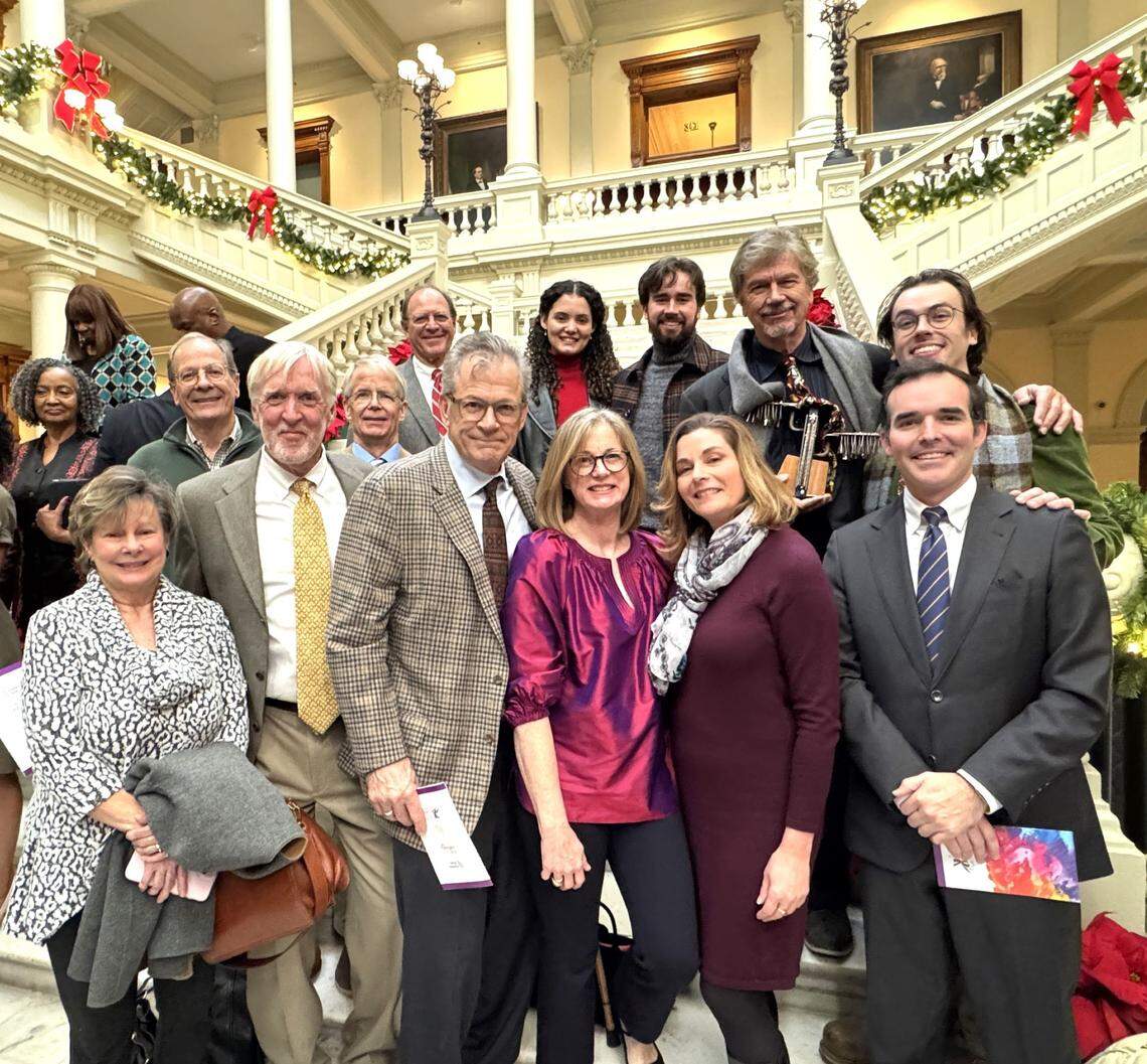 Columbus artist Garry Pound, second from right on back row, is joined by friends and family after he received one of the 10 Governor’s Awards for the Arts and Humanities during the ceremony Dec. 5, 2024, at the Georgia Capitol in Atlanta.