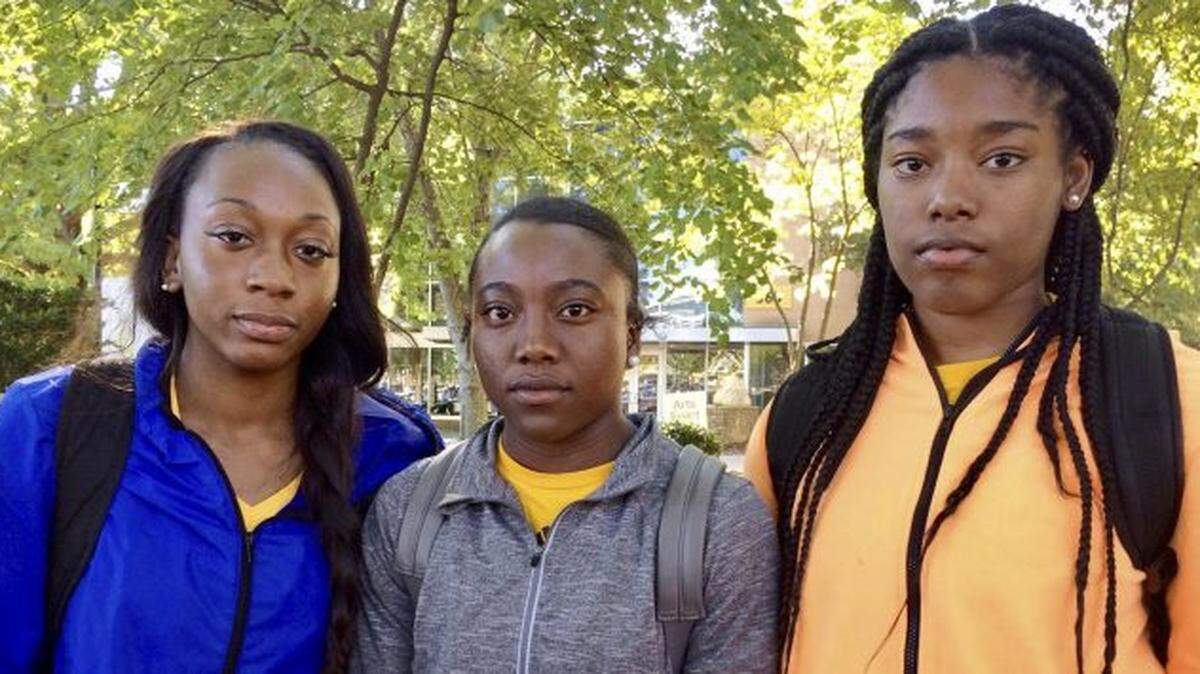 Shlondra Young, from left, Tommia Dean and Kennedy Town were among the group of Kennesaw State University cheerleaders who had protested racial injustice during the national anthem. A decision Wednesday will allow them back on the field for pre-game ceremonies.