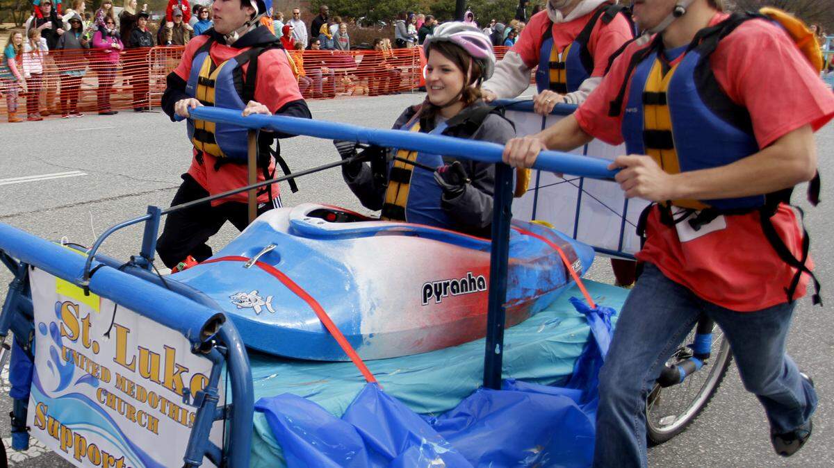 Joe Paull jpaull@ledger-enquirer.com 
 The St. Luke UMC team cross the finish ling during the 2015 VIP Bed Race downtown Saturday morning. 2/28/2015