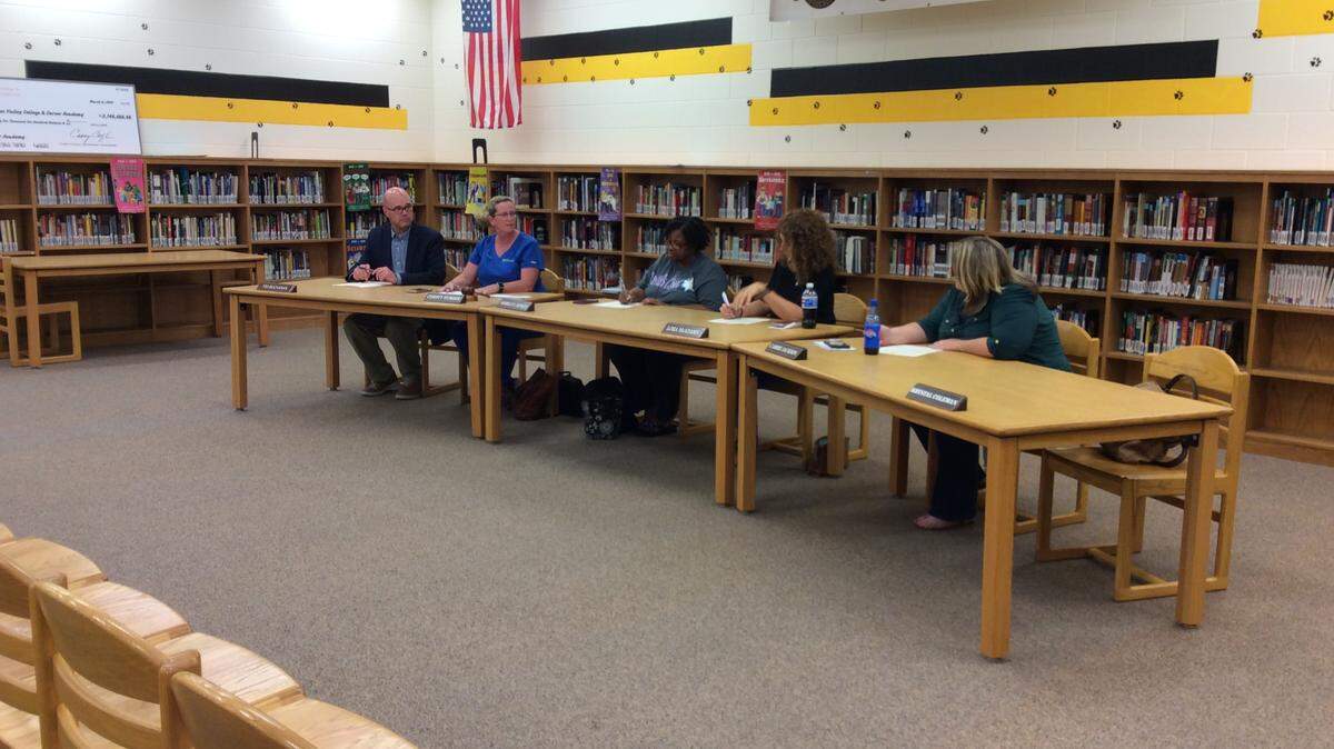The Chattahoochee County Board of Education conducts a called meeting July 2, 2018, in the library at Chattahoochee County Middle-High School.