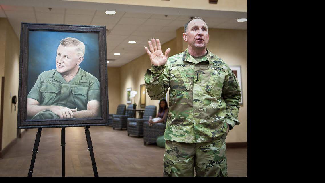 Gen. Robert Abrams at portrait of father, Gen. Creighton Abrams Jr. 
