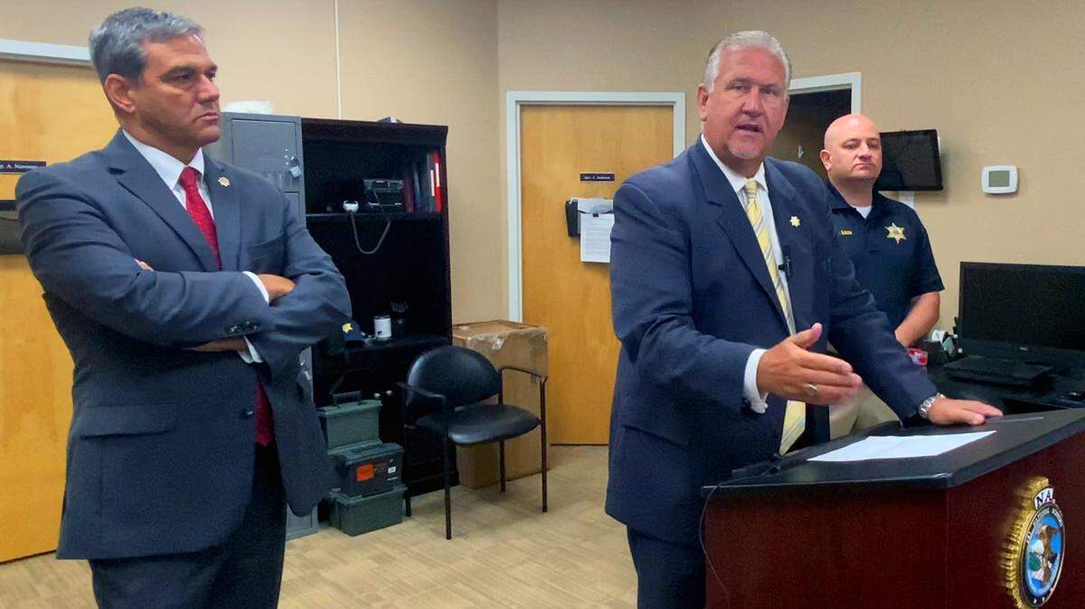 Russell County Sheriff Heath Taylor, center, speaks during a Thursday morning press conference at the Russell County Sheriff’s Office. A Russell County 16-year-old is facing capital murder charges after killing one man and shooting at another before stealing two vehicles he wrecked, the sheriff says. 08/17/2023
