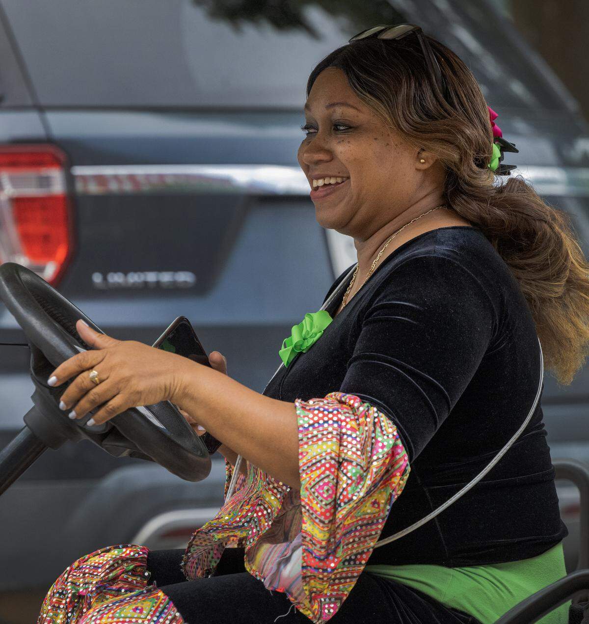 Tri-City Latino Association member Betssy Dortch was busy, zipping around on a golf cart, getting participants in place and keeping everything running smoothly May 2, 2026, at the Strut the Hooch parade in downtown Columbus.