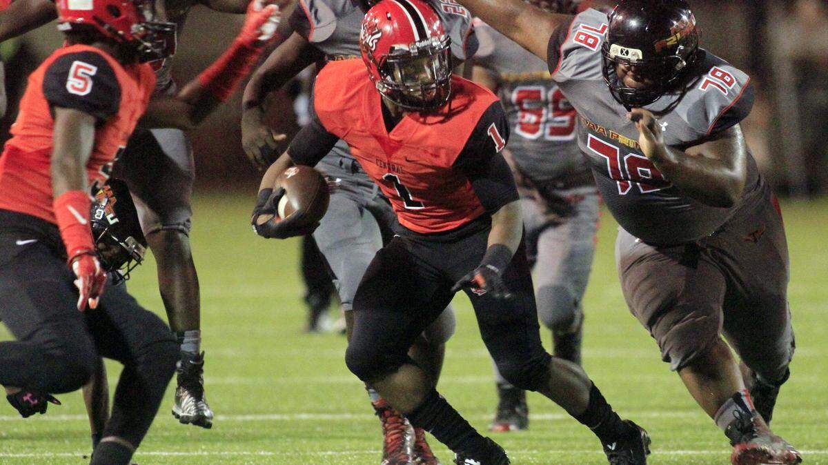ROBIN TRIMARCHI rtrimarchi@ledger-enquirer.comCentral High running back Jaxton Carson rushes against Triple A Academy at Garrett-Harrison Stadium Friday.  10.09.15