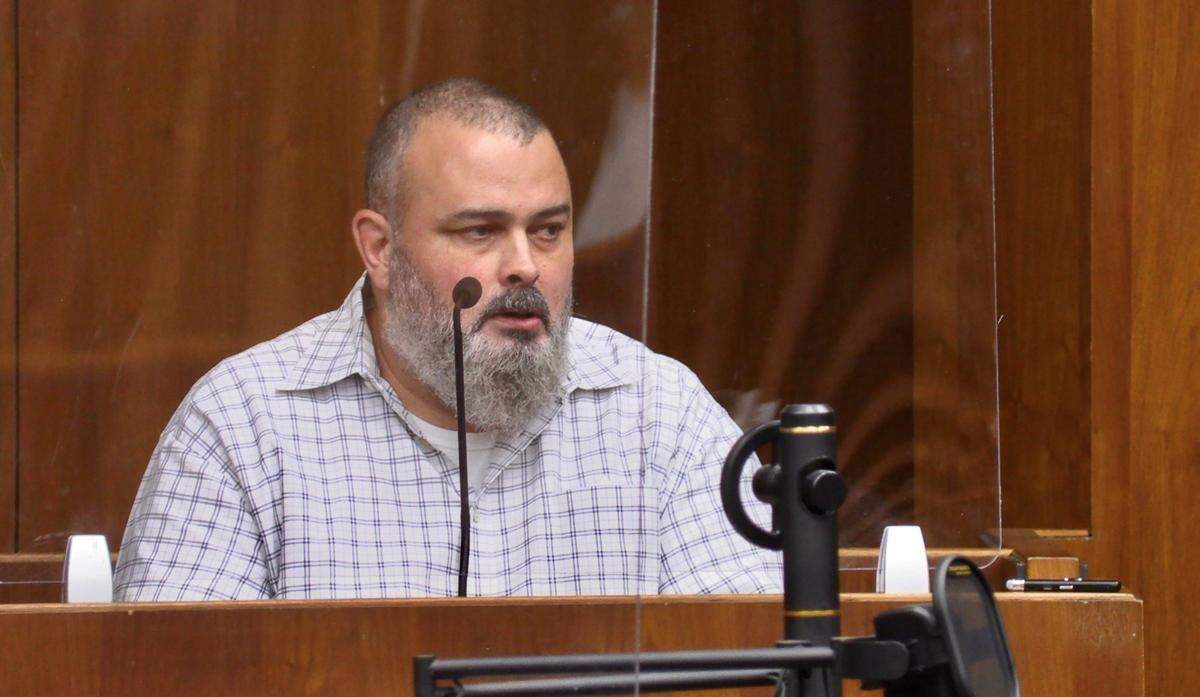 Chris Bailey testifies during Mark Jones’ misconduct trial.