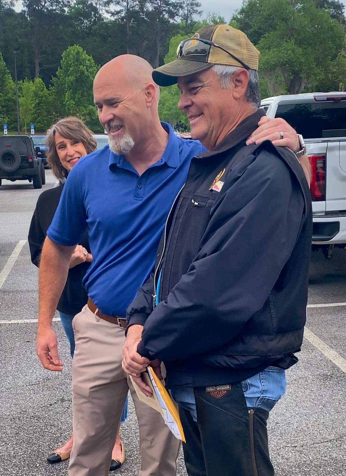 The Miracle Riders made the first stop on their 9,300-mile, Pony Express-themed ride from Columbus on May 1, 2026, at the National Infantry Museum and Soldier Center, where rider Brian Brock, right, read a postcard written by Ken Killingsworth, left, about U.S. Army Sgt. 1st Class Alwyn Cashe, who was awarded the Medal of Honor for his actions during Operation Iraqi Freedom.