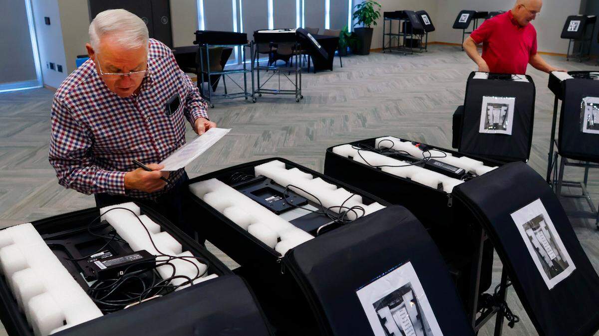 Election workers in Columbus, Georgia begin the process of setting up Precinct #117, located inside the Cunningham Conference Center at Columbus State University. 05/20/2024
